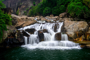 Obraz premium Manimuthar Falls, a gorgeous Waterfall in the midst of a forest in western ghats of South India 