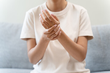Close-up shot of human hands suffering from ligament inflammation on the palm.