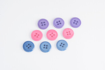Four-hole buttons in various colors and sizes.