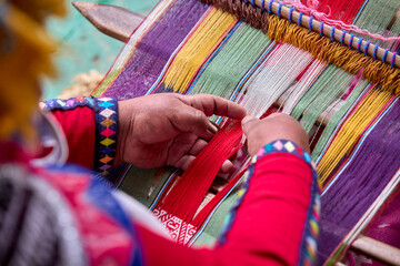 The hands of a weaver hold generations of skill, patience, and creativity, turning simple strands into works of art. Each weave is a journey, each knot a memory.  Chinchero Cusco Peru.
