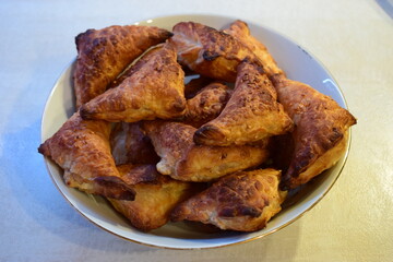 Golden-Brown Triangular Pastries Freshly Baked