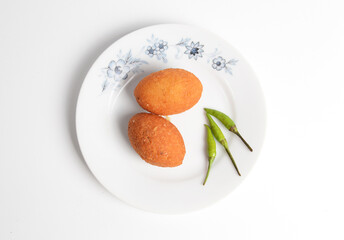 Combro, a traditional snack from West Java, Indonesia, made from grated cassava with seasoned oncom inside. Oncom is made from various by-products such as from the making of tempeh or tofu.