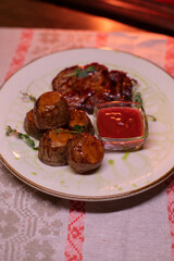 Beautiful restaurant dish golden potatoes and juicy meat, beautiful food photo