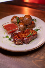 Beautiful restaurant dish golden potatoes and juicy meat, beautiful food photo