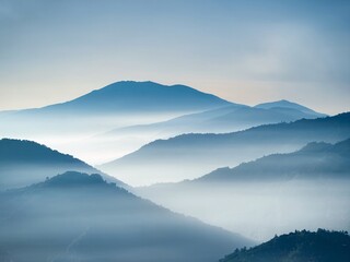 Peaceful Blue Mountain Landscape with Gentle Mist and Soft Blue Shades