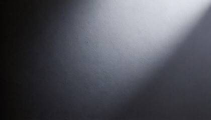 Fototapeta premium Dramatic beam of light on dark wall
