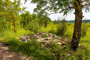 Illegal garbage dump on the side of the road in the countryside, Kaluga region, Russia