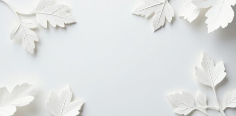 Delicate white paper cutout leaves scattered on a snowy white background, paper cut, winter