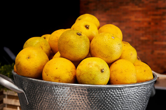 Fresh Puerto Rican Oranges in a Rustic Metal Basket