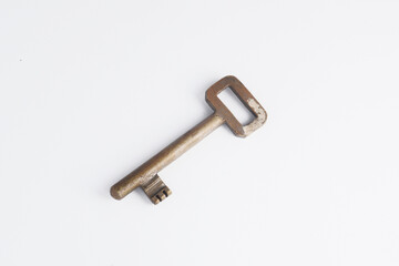 An brass old key with clipping path on white background. 