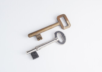 A brass and and iron old keys with clipping path on white background. 