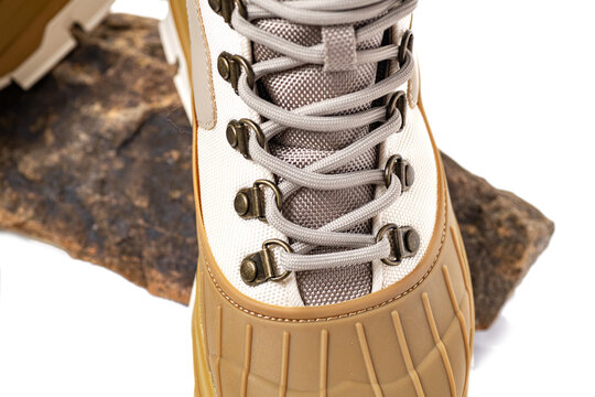 Reliable demi-season boots for hacking with laces. Close-up on white background.