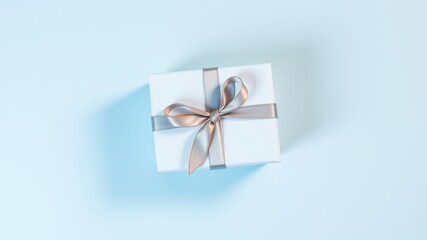 Obraz premium A single elegantly wrapped present with a delicate ribbon bow on a pastel blue background