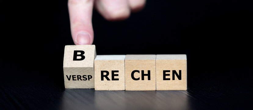 Cubes form the German expression 'Versprechen brechen' (broken promise).