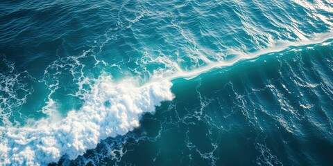 Ocean wave breaking, turquoise water, white foam, sea surface