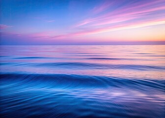 Obraz premium Tranquil purple-blue waves gently wash a minimalist beach.