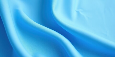 Obraz premium Soft Blue Fabric Draped in Gentle Waves, a Textured Background