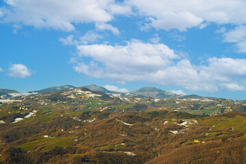 Fototapeta premium Snowy winter scene in an old mountain village with traditional houses and nature.