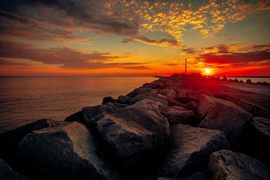 Close-up of a coastal rock wavebreaker  along the Baltic Sea at sunset, Lithuania