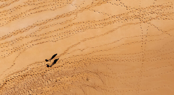 Aerial view of two people standing on Sotovento beach, Costa Calma, Fuerteventura, Canary Islands, Spain