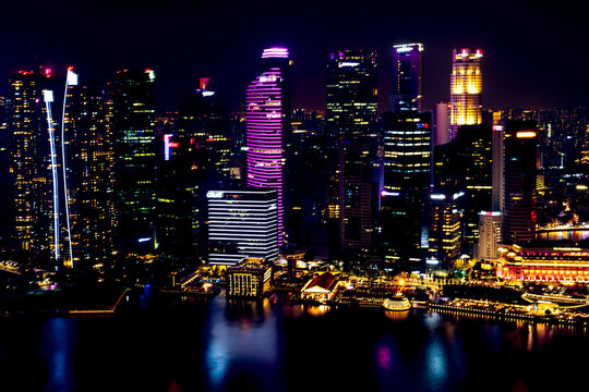 View into land of skyscrapers in Marina Bay at night, Singapore