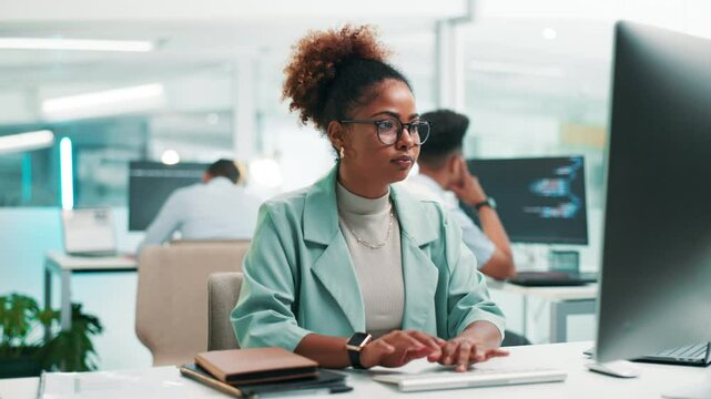 Woman, software developer or typing with computer for app development or coding at office desk. Female person, programmer or coder with glasses or technology for UI, UX or AI programming at workplace