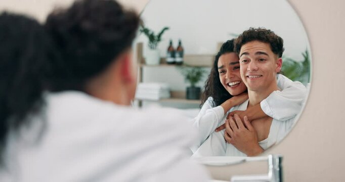 Bathroom, mirror and happy couple hug for love, care and talking for healthy relationship together. Reflection, man and woman embrace in home for romance, morning routine and skincare for beauty