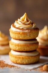 A swirl of golden brown cinnamon roll topping adds a pop of color to the stack, treats, swirly icing, stacked