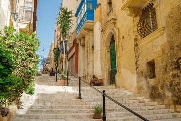 Touristic street with stairs in the center of Valletta, Malta