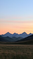 Obraz premium Serene sunrise over majestic mountains rocky plains landscape tranquil environment wide angle view nature's beauty
