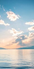 Fototapeta premium Peaceful ocean horizon with clear blue skies and soft clouds during serene sunset : Generative AI