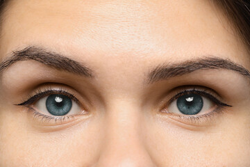 Closeup view of woman with blue eyes