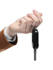 Woman with car key on white background, closeup. Buying auto