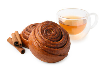Delicious cinnamon roll buns with tea and spices isolated on white