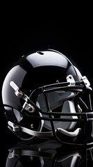 Fototapeta premium Black Football Helmet with Facemask on Black Background