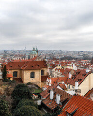 Fototapeta premium Panoramic view on Prague Historical Gothic Medieval castle and church complex, St. Vitus Cathedral, Charles Bridge, astronomical clock, Basilica of St. George, Unesco city tourism