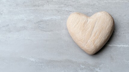 Fototapeta premium Wooden heart on marble; love, romance concept; Valentine's Day card