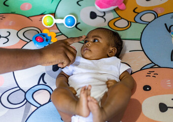 A little girl doing tummy time, a little girl. Newborn premature baby. Tummy time is fun time....