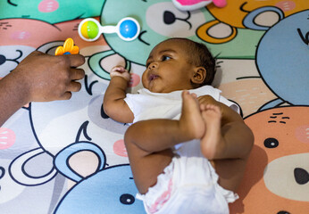 A little girl doing tummy time, a little girl. Newborn premature baby. Tummy time is fun time....