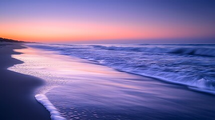 Fototapeta premium Tranquil Ocean Waves Lapping Against Scenic Coastal Shoreline at Sunset