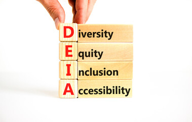 DEIA symbol. Concept words DEIA diversity equity inclusion accessibility on blocks. Beautiful white...