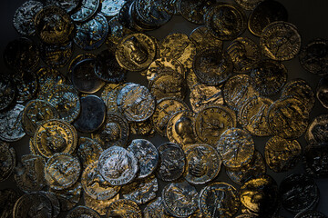 Pile of shimmering ancient Roman coins.
