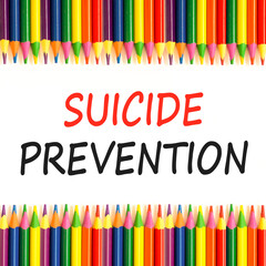 Suicide prevention symbol. Concept words Suicide prevention on beautiful white paper. Colored pencils. Beautiful white paper background. Psychological and suicide prevention concept. Copy space.