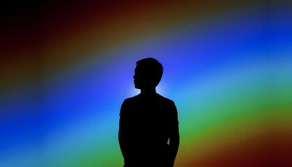 Silhouette of a person against a vibrant colorful background during a creative art display. Generative AI