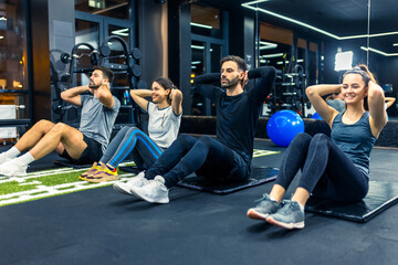 Group of people doing ab training.