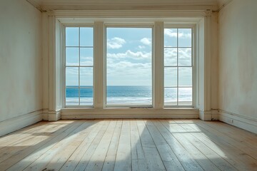 Fototapeta premium An empty beach house apartment with wooden floors and windows that present a sea view, offering a serene and spacious environment with plenty of room for creative use.