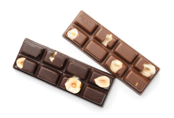 Tasty chocolate bars with nuts isolated on white, top view