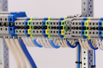 Electrical screw terminals for connecting wires in an electrical switchboard. Soft focus. Close-up.