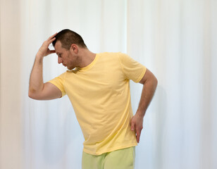Male choreography in motion in the studio. Young man dancing in a dance studio