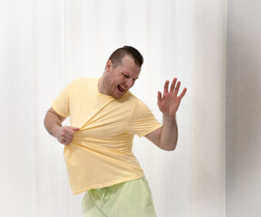 Male choreography in motion in the studio. Young man dancing in a dance studio